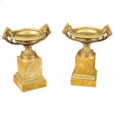Pair of gilded bronze and yellow marble risers, 1930s