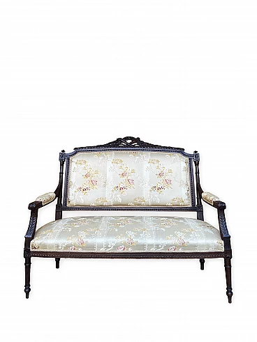 Carved wooden sofa and floral fabric in Louis XVI style, early 20th century