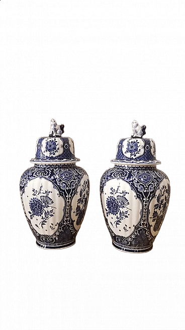 Pair of Delft ceramic lidded vases