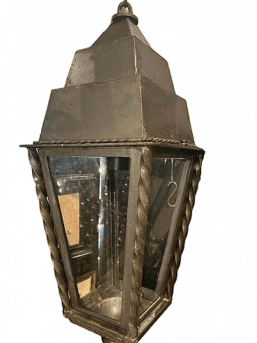 Iron hanging lantern with twisted decorations