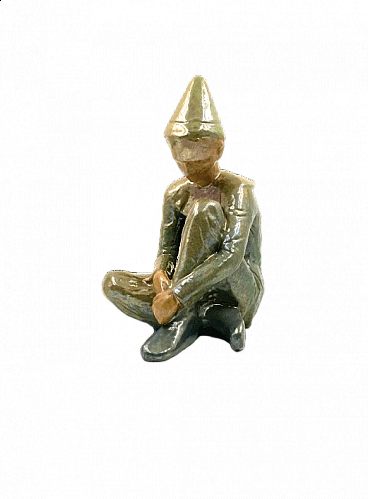 Giordano Tronconi, Seated boy, green ceramic figure from Faenza, 1950s