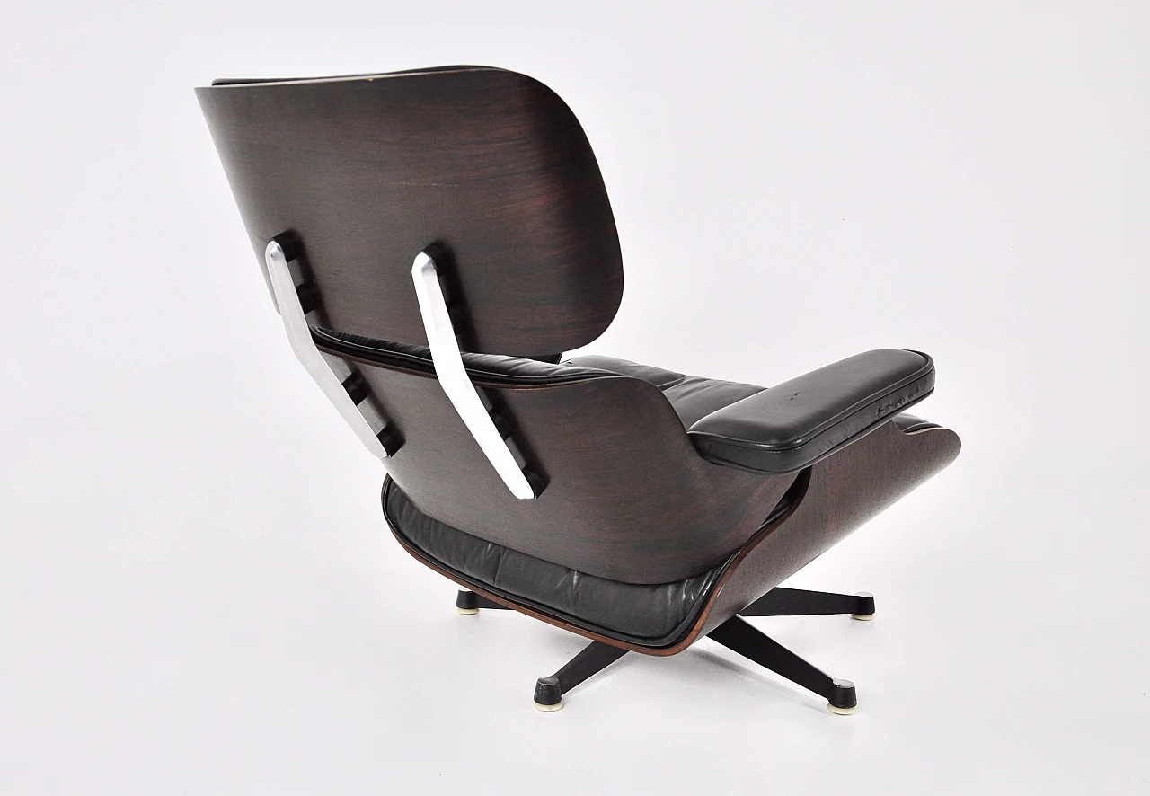 Black leather and wood armchair with ottoman by Charles and Ray Eames for ICF, 1970s 10