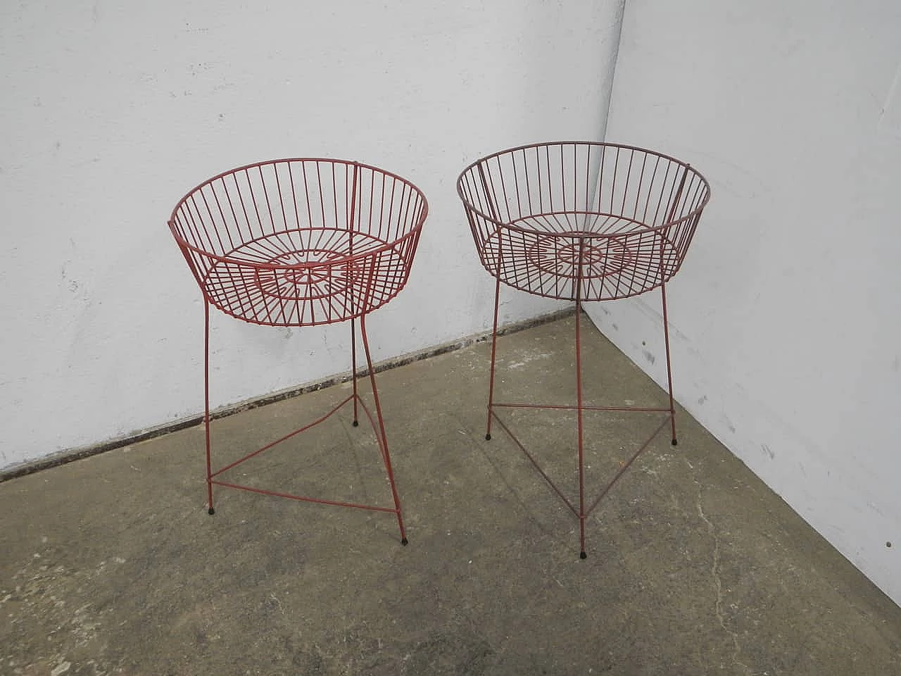 Pair of red plastic-coated metal display baskets, 1960s 1