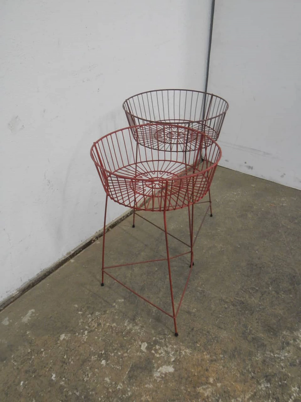 Pair of red plastic-coated metal display baskets, 1960s 2