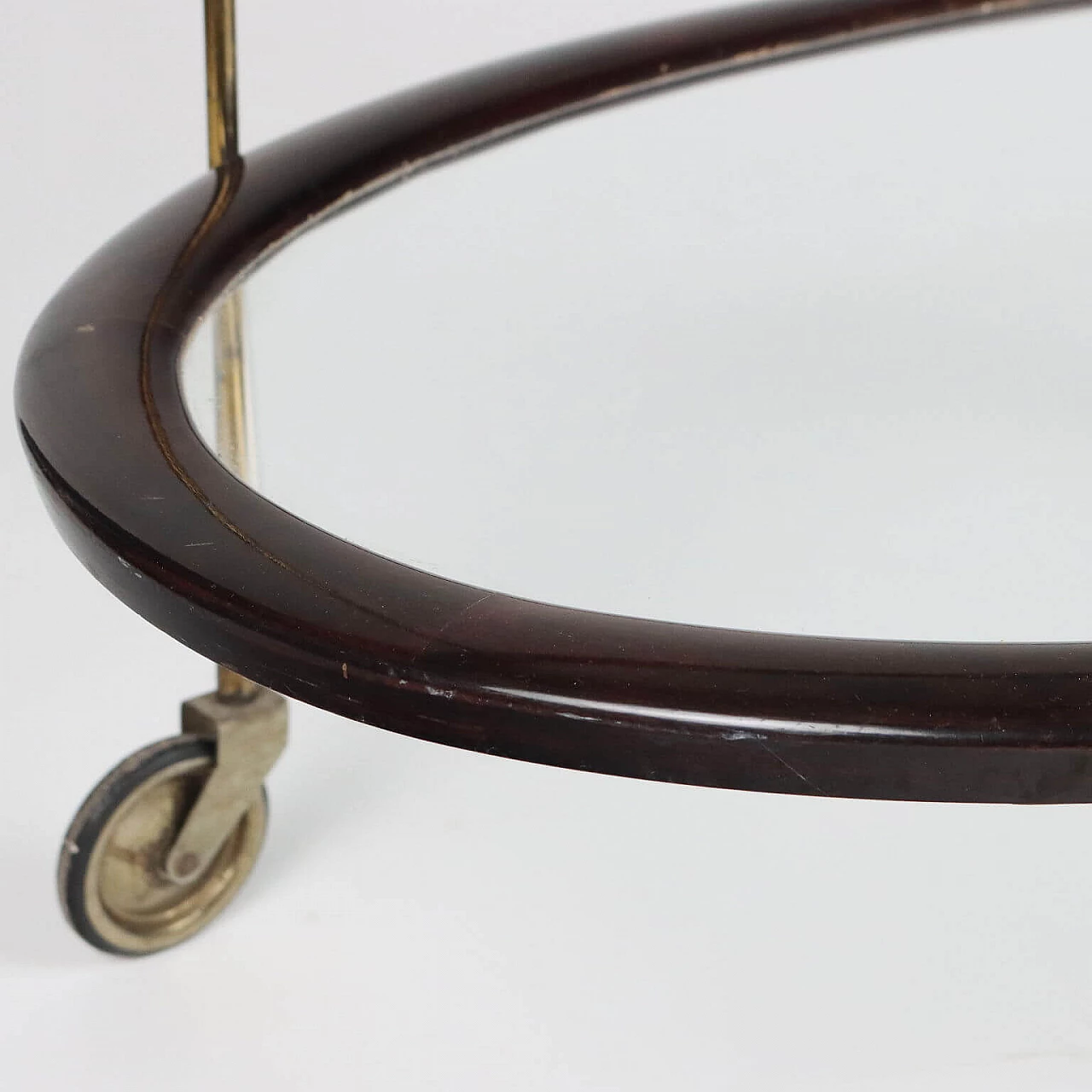 Oval ebony-stained wood and glass bar cart, 1950s 8