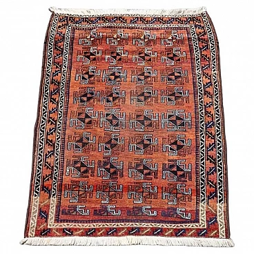 Baluch hand-knotted wool rug with geometric tribal design, 1930s