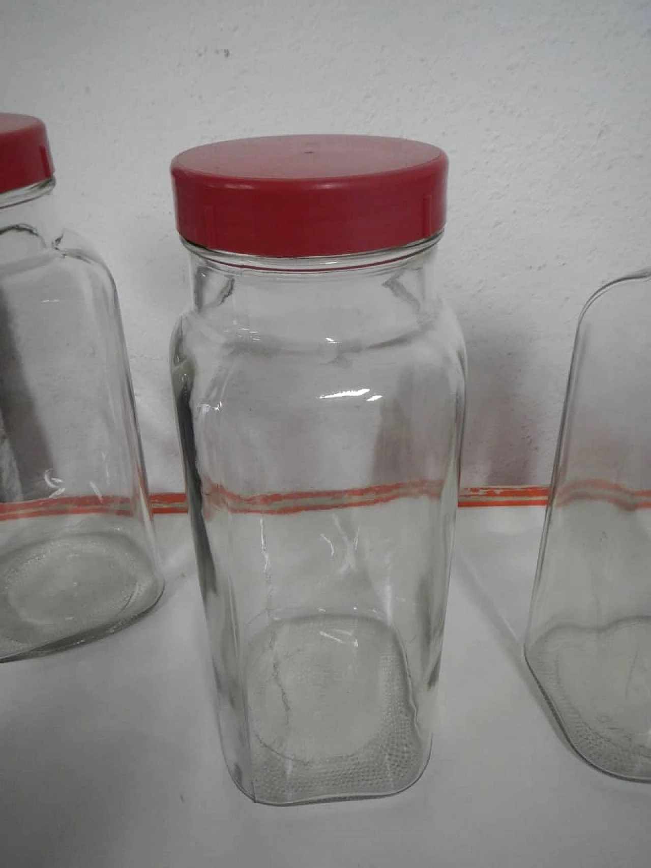 3 Glass store jars with red plastic caps, 1970s 3