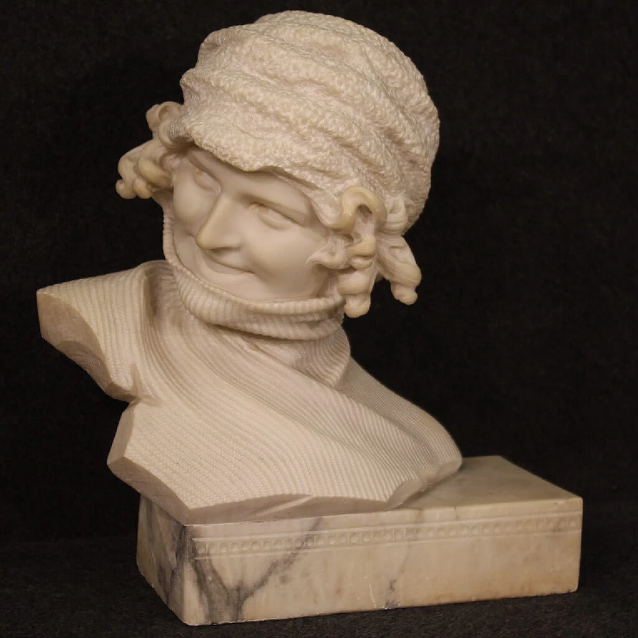 Marble sculpture of girl with hat and turtleneck 1