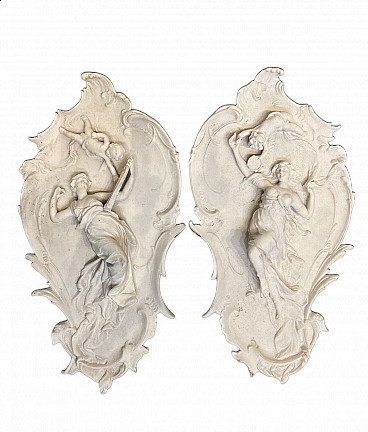 Pair of Art Nouveau stone paste plaques with female figures and putti