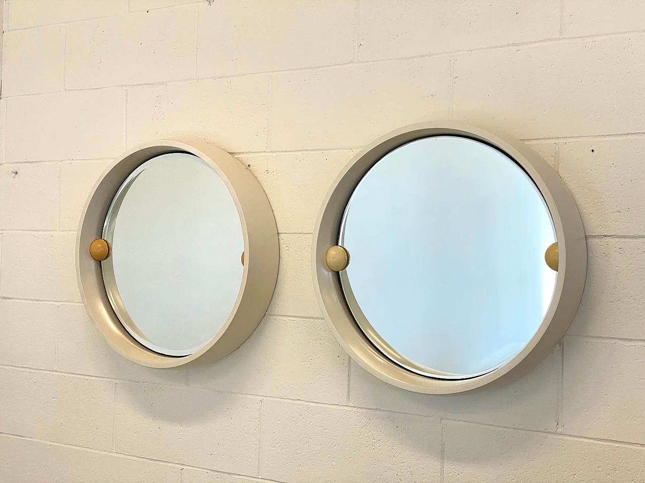 Pair of round ivory lacquered wood tilting mirrors, 1970s 1