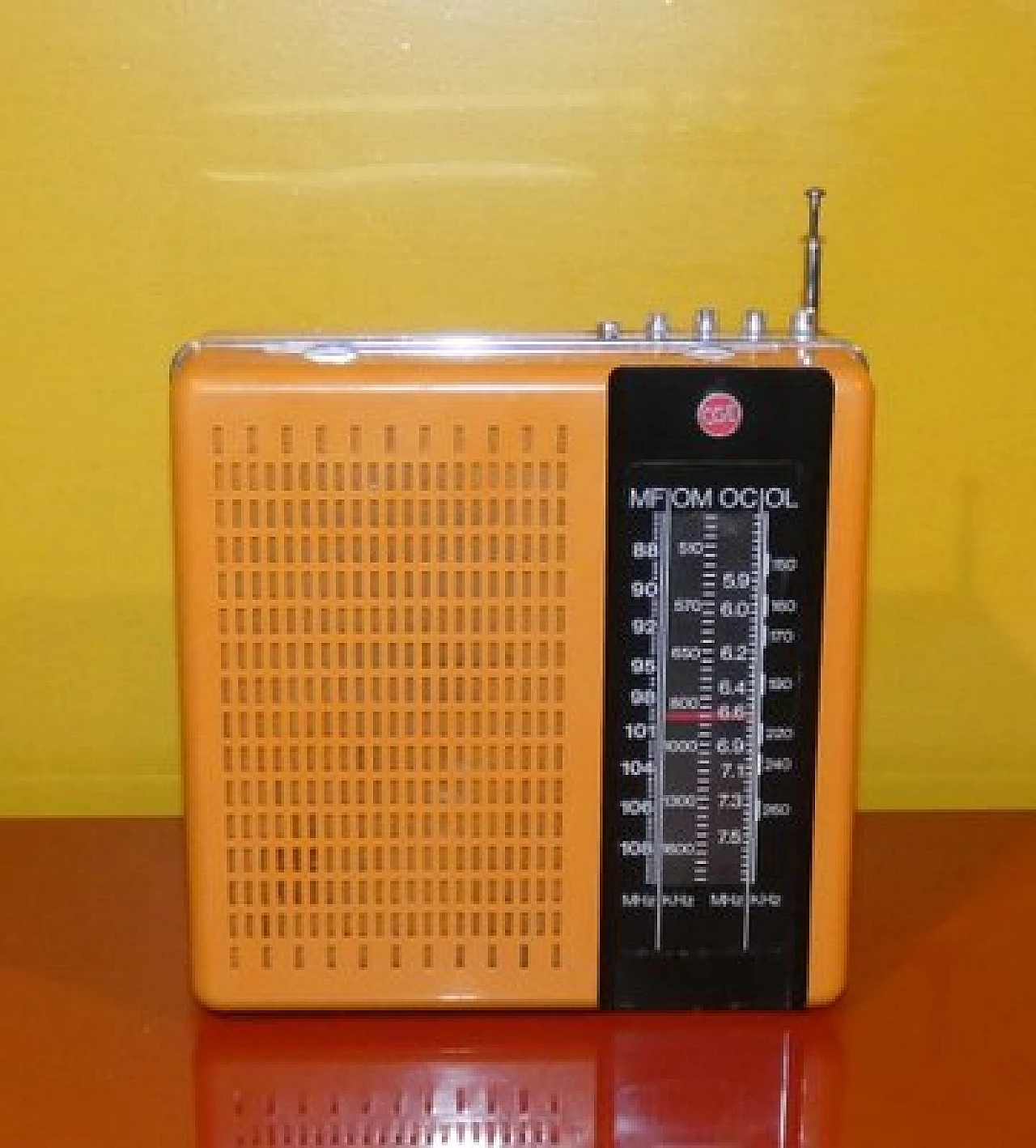 Orange and black plastic portable radio by CGE, 1970s 1