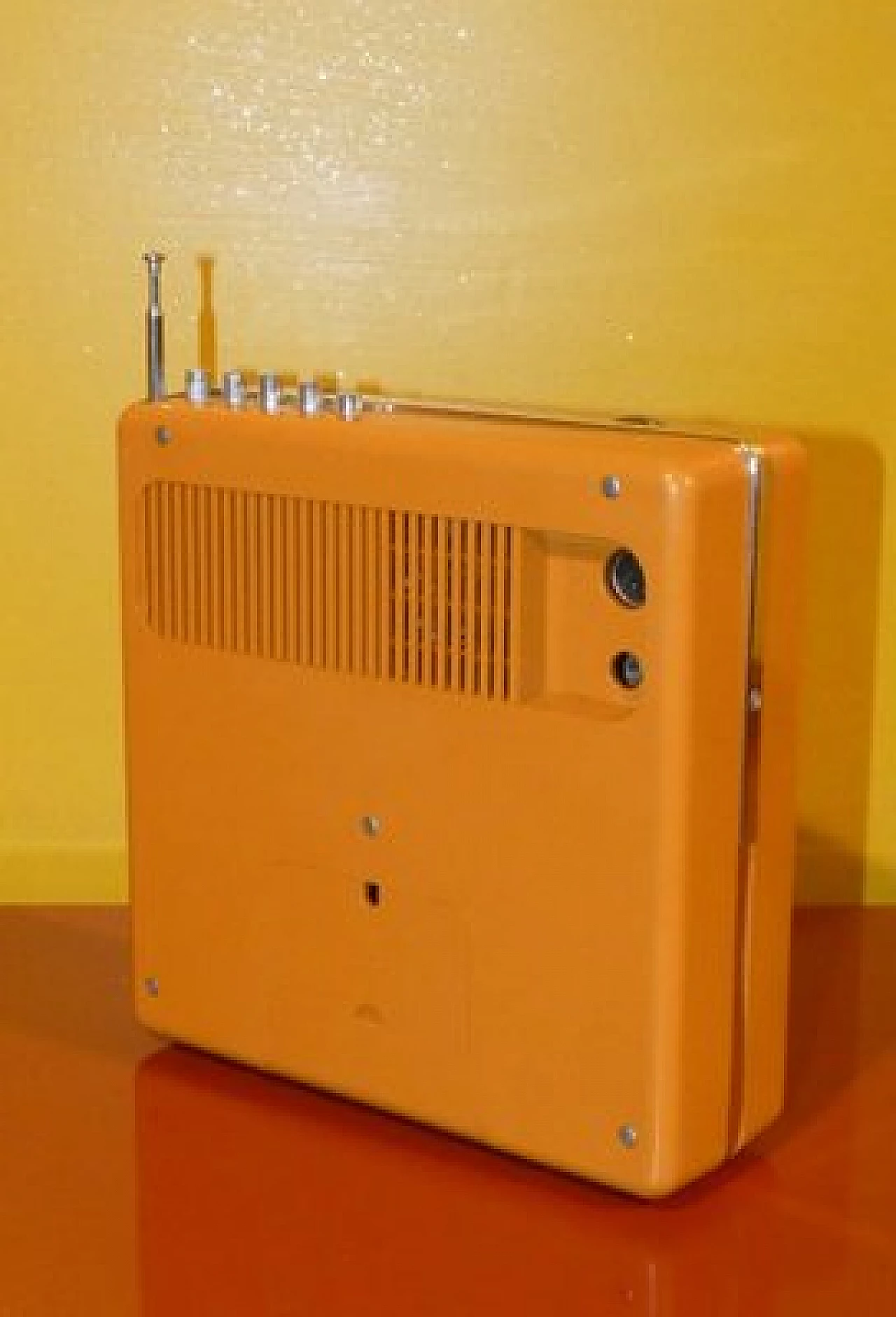 Orange and black plastic portable radio by CGE, 1970s 6