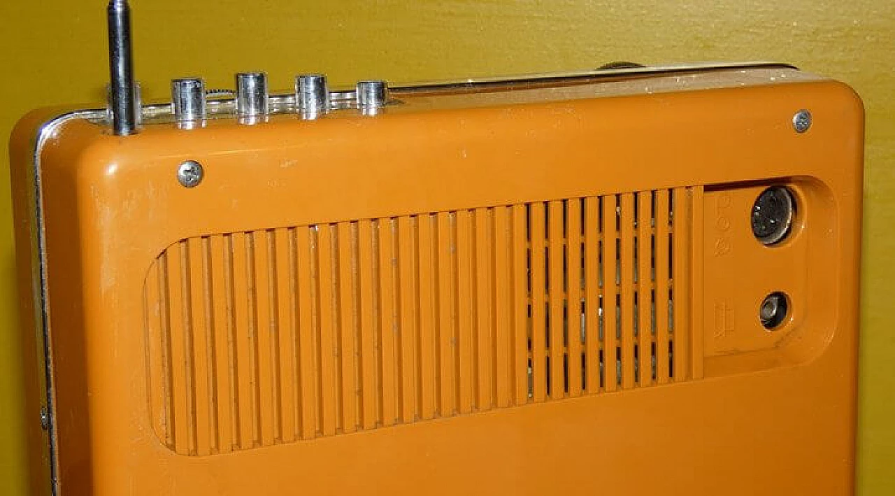 Orange and black plastic portable radio by CGE, 1970s 7