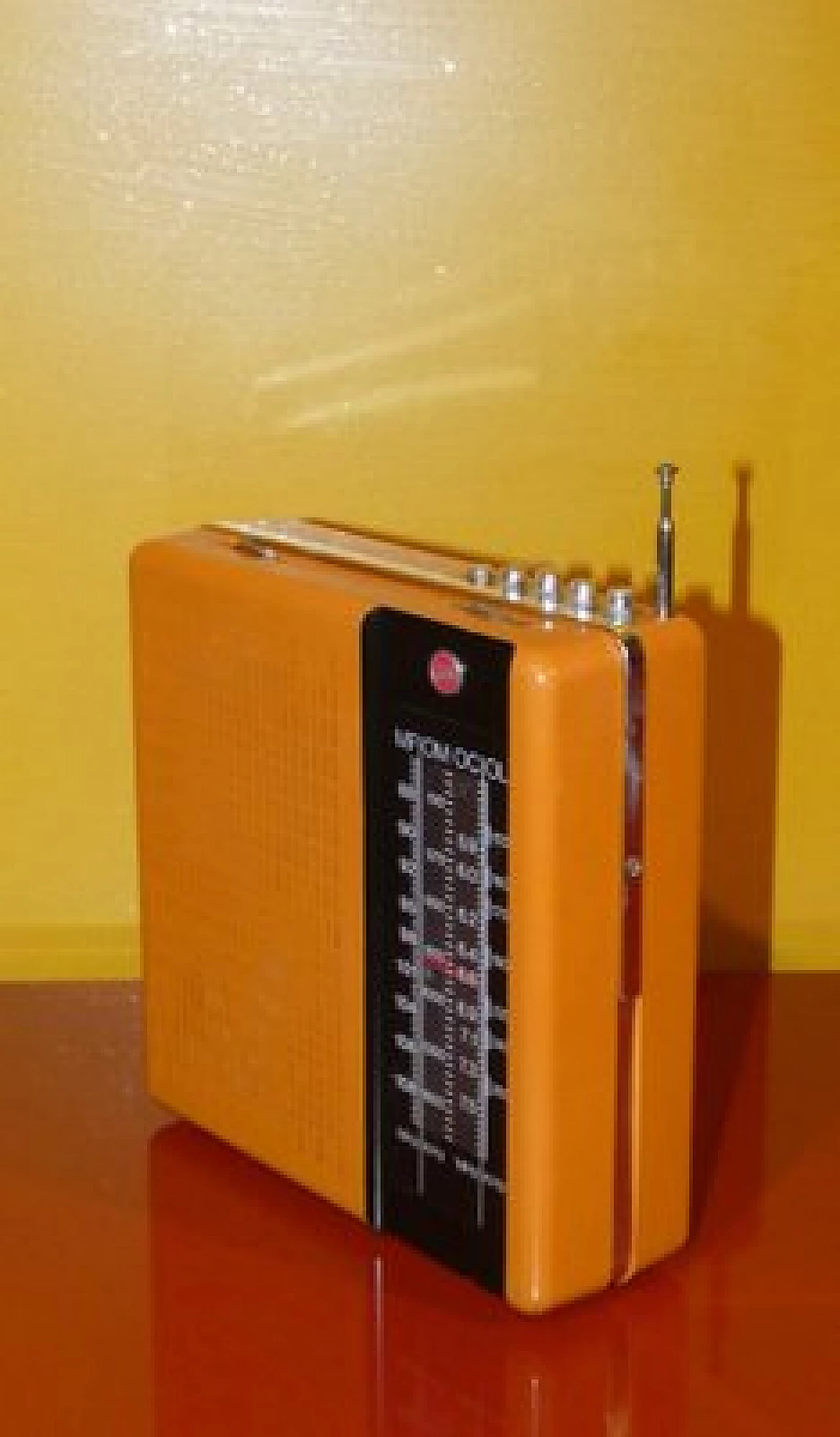 Orange and black plastic portable radio by CGE, 1970s 8
