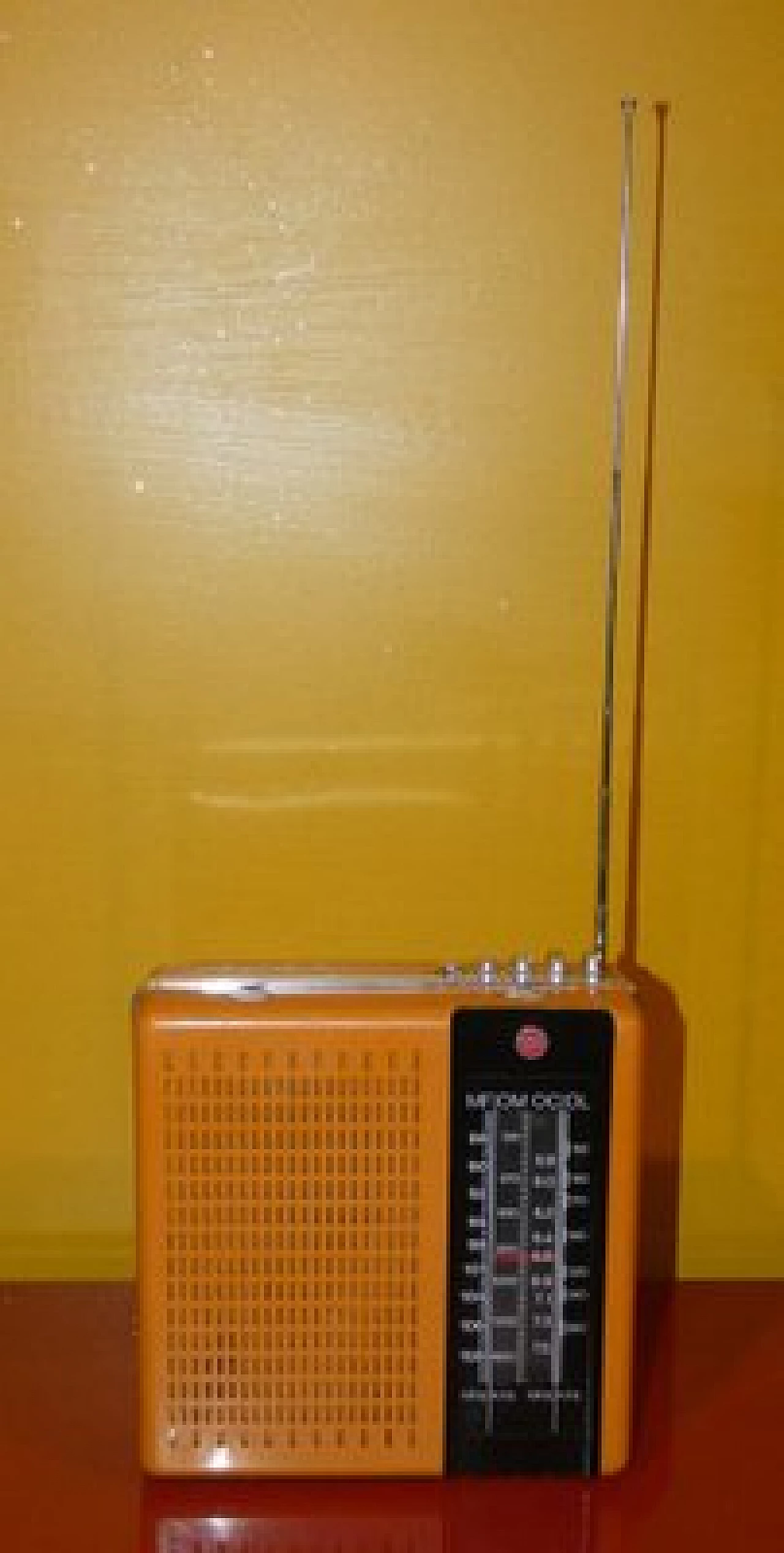 Orange and black plastic portable radio by CGE, 1970s 9