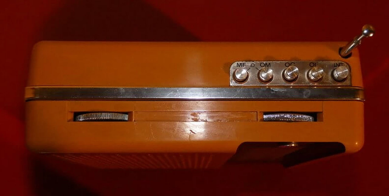 Orange and black plastic portable radio by CGE, 1970s 10