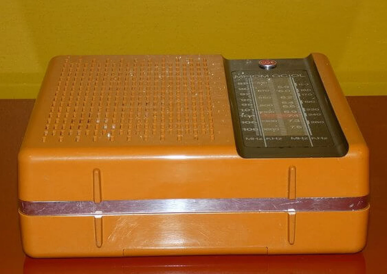 Orange and black plastic portable radio by CGE, 1970s 11