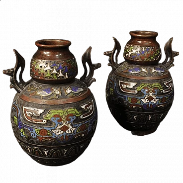 Pair of oriental chiseled metal vases with cloisonné enamels