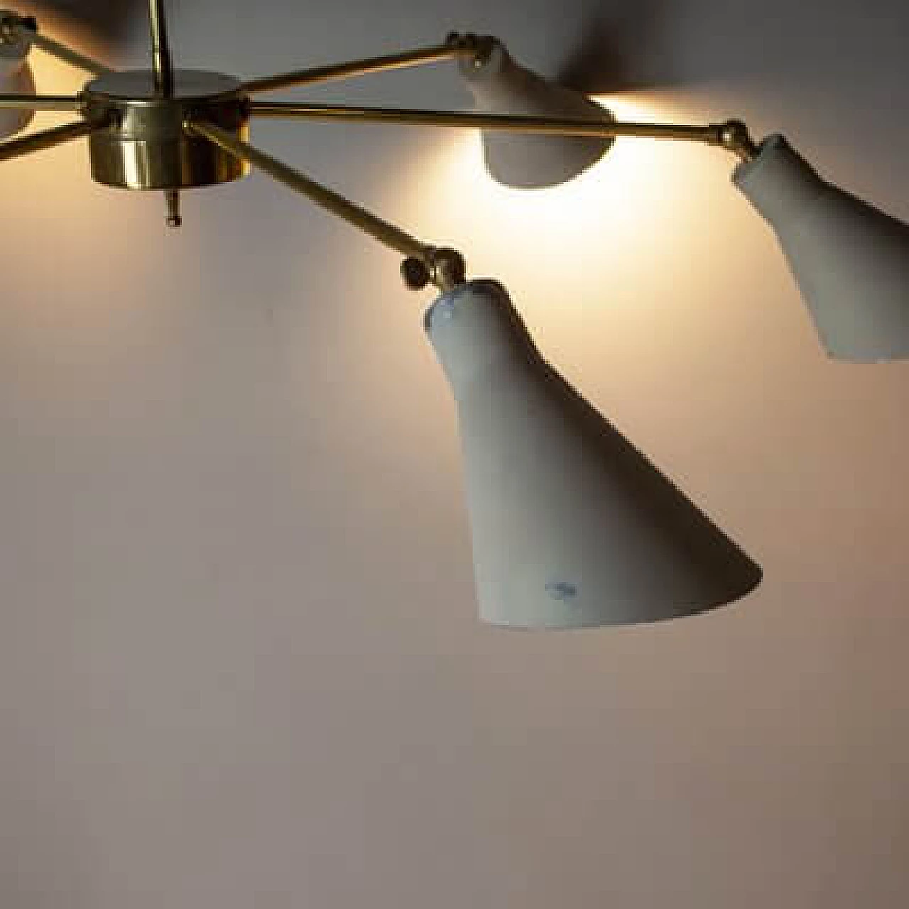 Light chandelier with aluminium shades and brass frame in the style of Stilnovo Models, 1950s 2