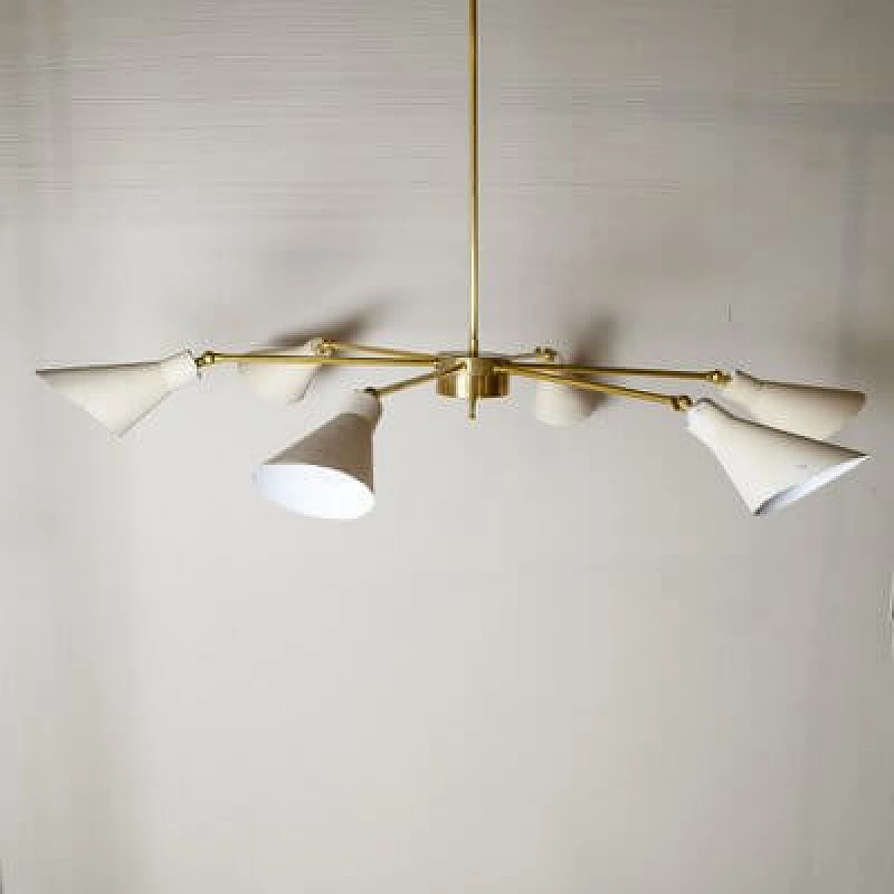 Light chandelier with aluminium shades and brass frame in the style of Stilnovo Models, 1950s 4