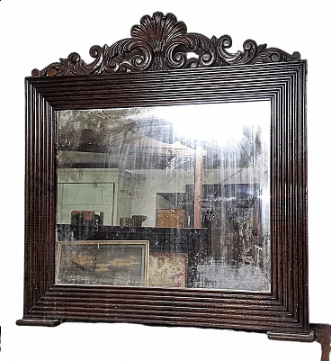 Walnut-framed mirror with carved cimasa, late 19th century