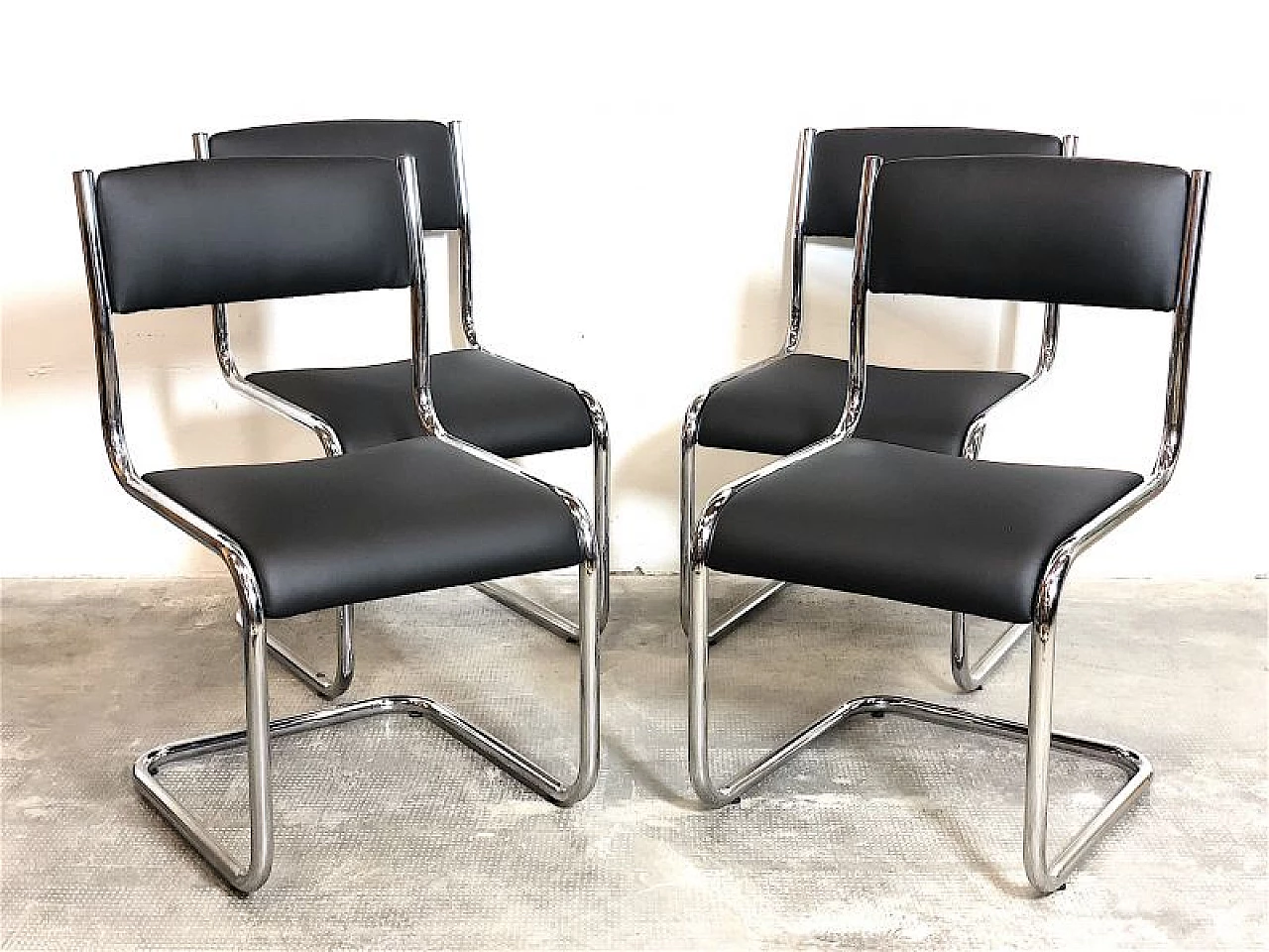 4 Chairs in chromed tubular metal and black leather, 1970s 3