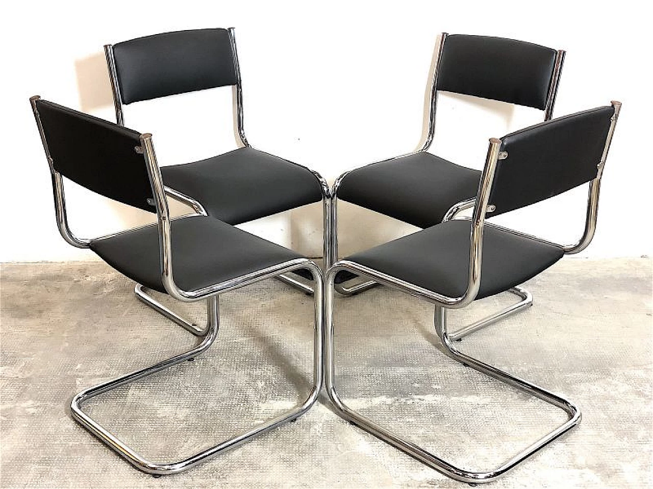 4 Chairs in chromed tubular metal and black leather, 1970s 6