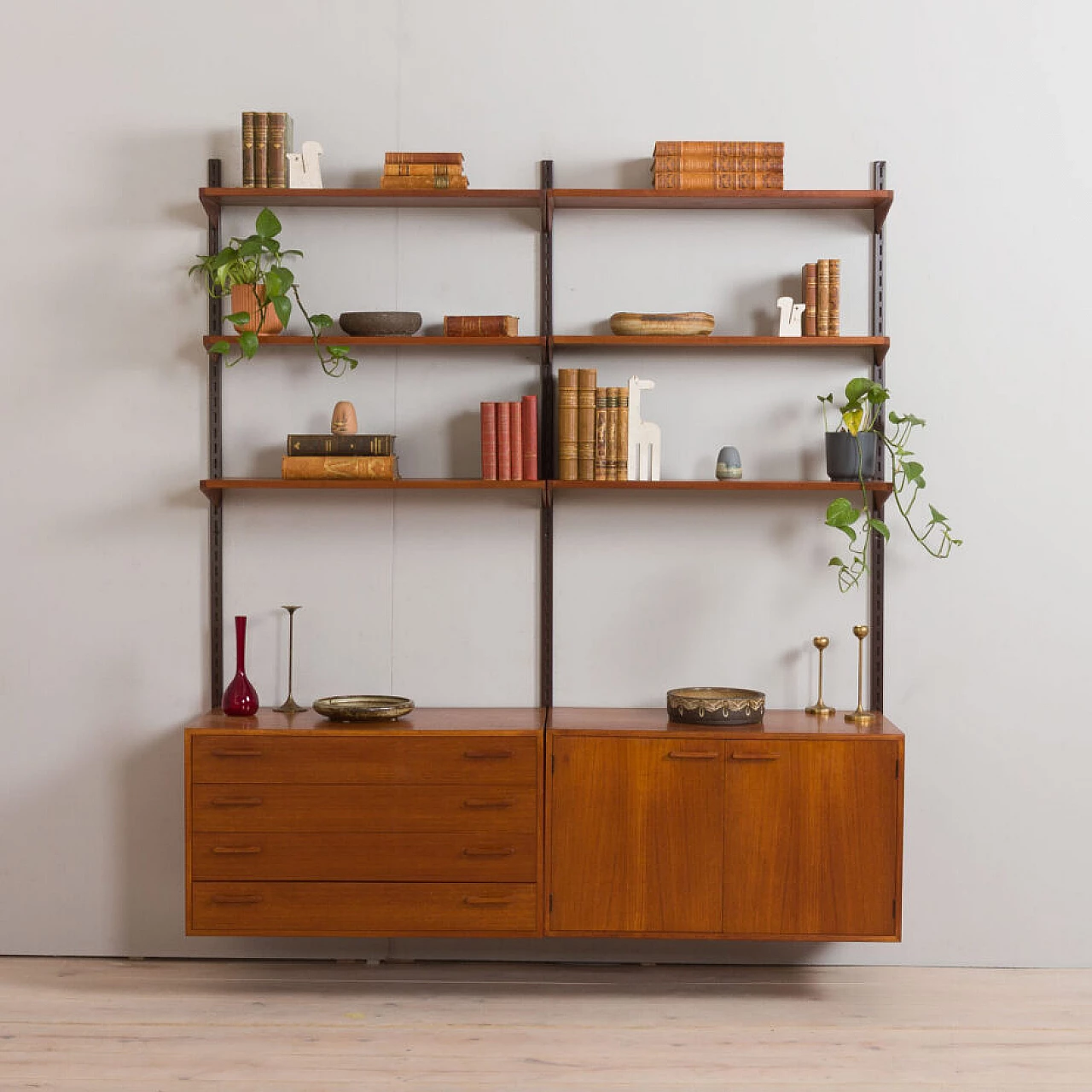 Danish modular wall-mounted teak bookcase with cupboard and drawers by K. Kristiansen, 1960s 2
