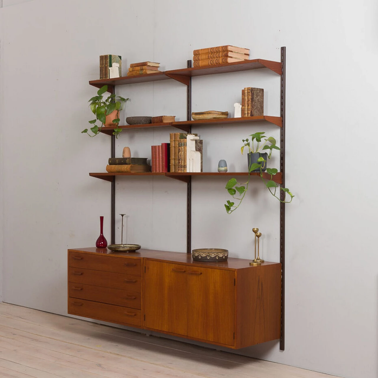 Danish modular wall-mounted teak bookcase with cupboard and drawers by K. Kristiansen, 1960s 3