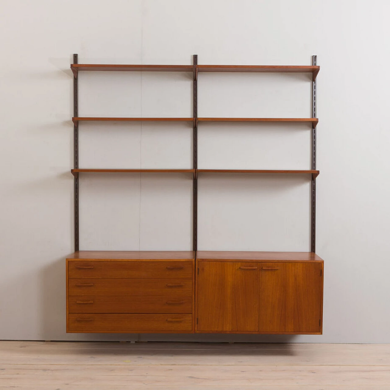Danish modular wall-mounted teak bookcase with cupboard and drawers by K. Kristiansen, 1960s 4