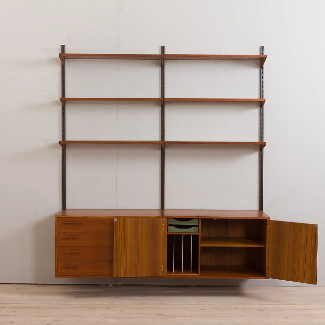 Danish modular wall-mounted teak bookcase with cupboard and drawers by K. Kristiansen, 1960s 5