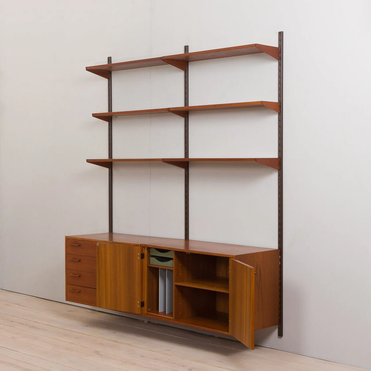 Danish modular wall-mounted teak bookcase with cupboard and drawers by K. Kristiansen, 1960s 6