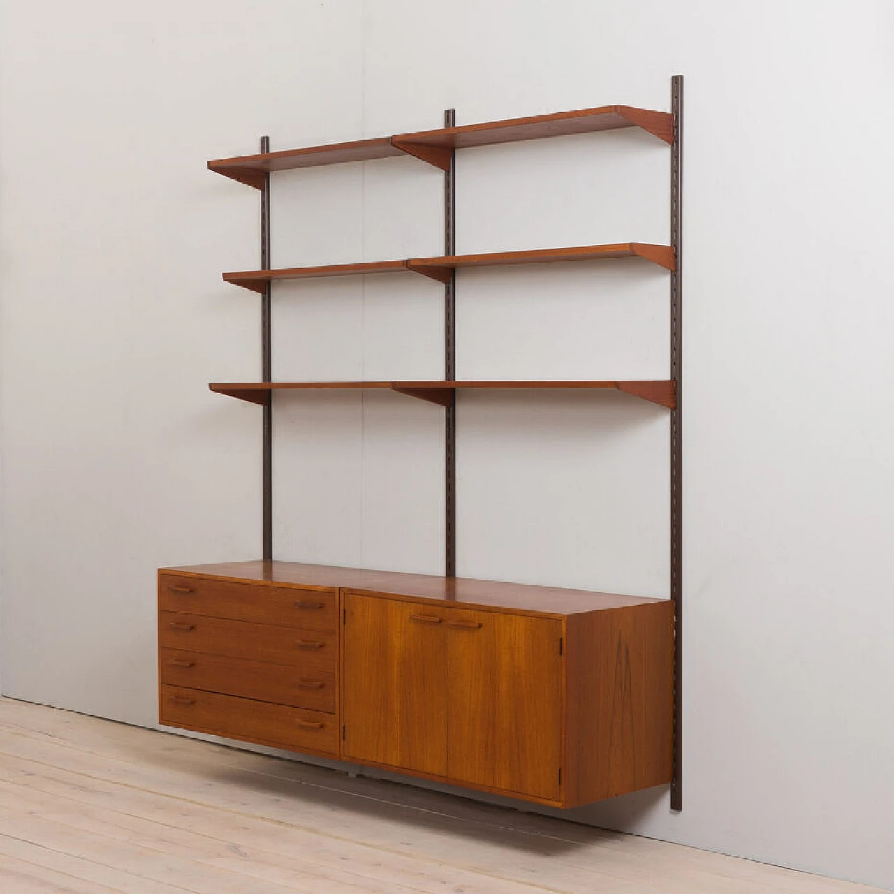 Danish modular wall-mounted teak bookcase with cupboard and drawers by K. Kristiansen, 1960s 10