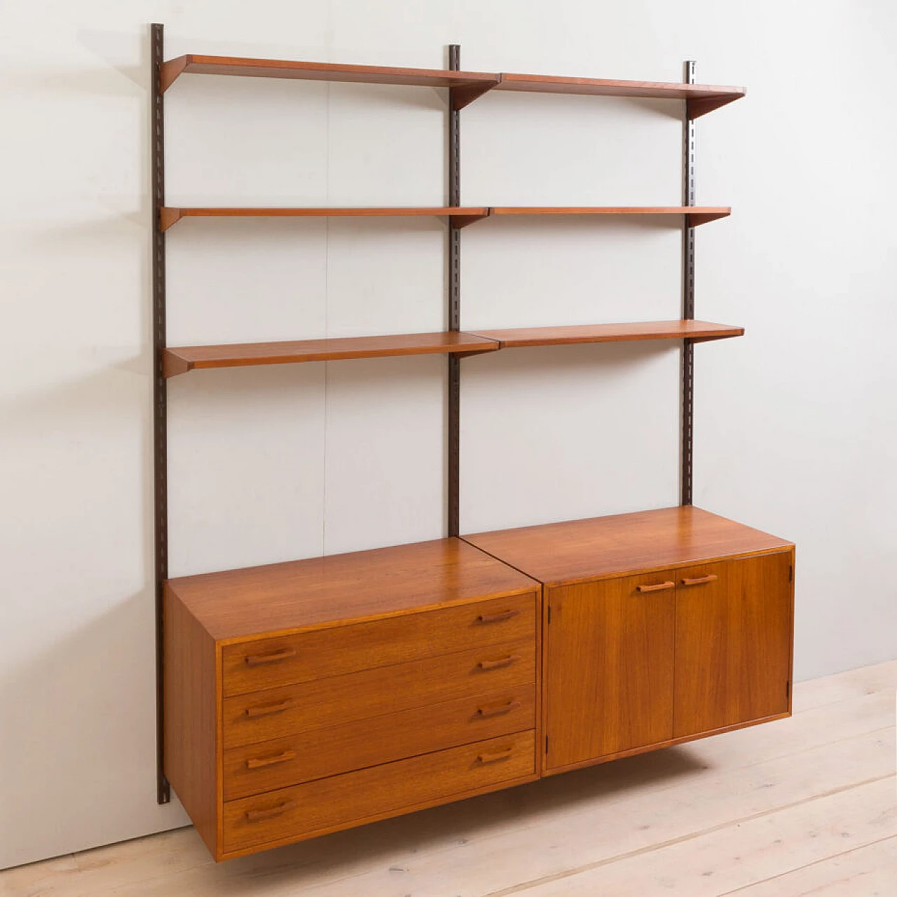 Danish modular wall-mounted teak bookcase with cupboard and drawers by K. Kristiansen, 1960s 11