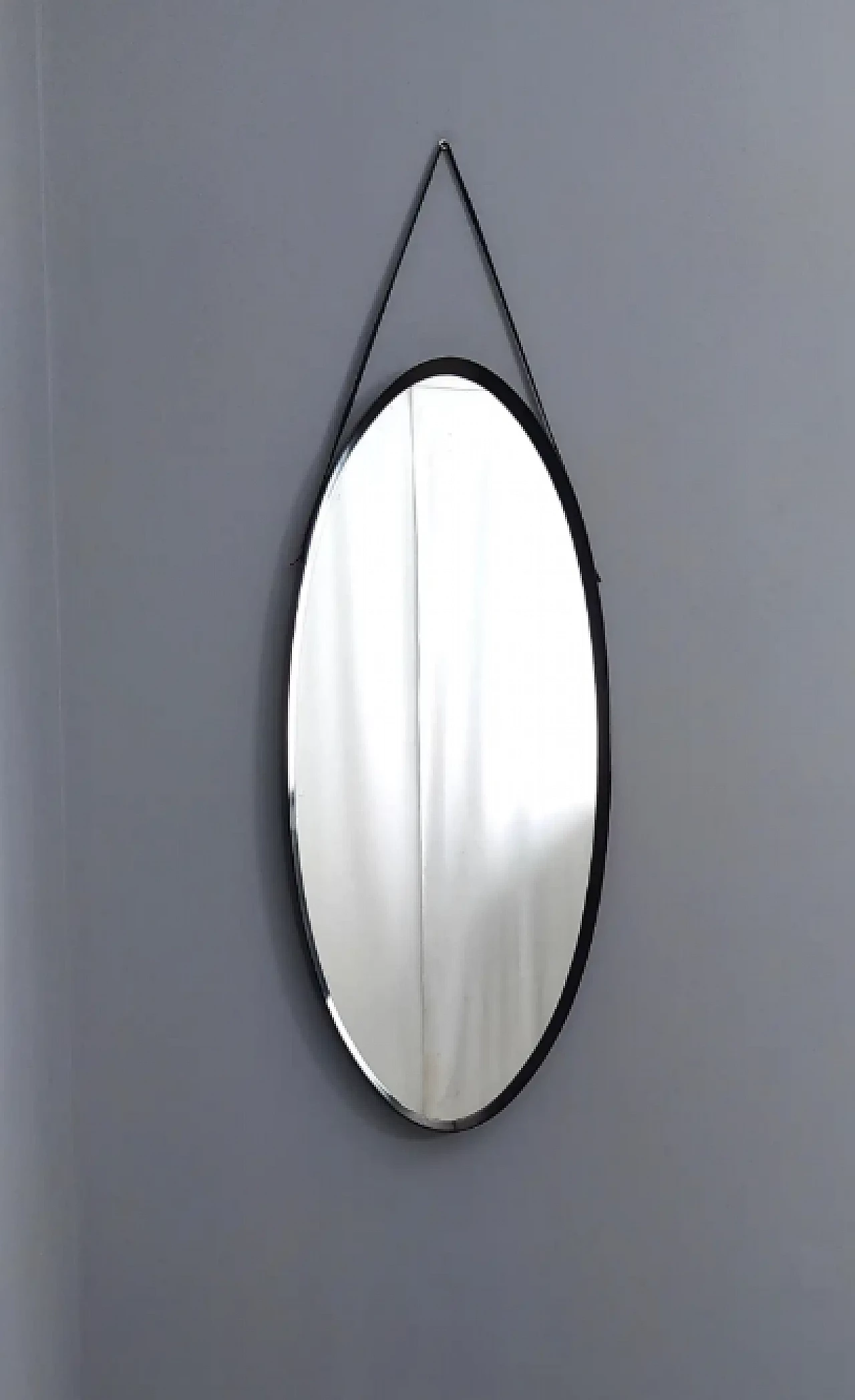 Oval wall mirror with ebonised wood frame and leather hook, 1960s 4
