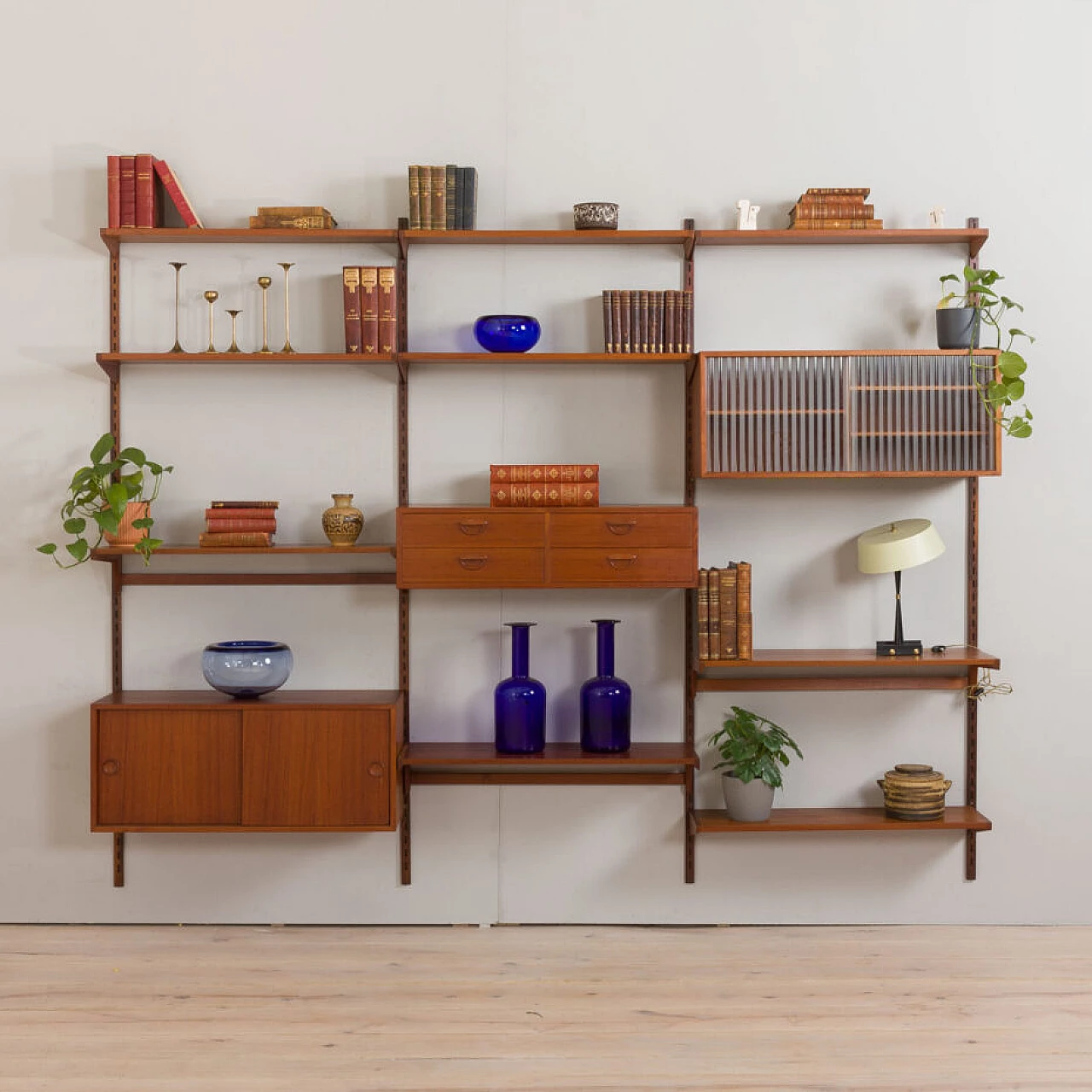 Modular teak bookcase with nine wall shelves and three cabinets by K. Kristiansen for FM Mobler, 1960s 4