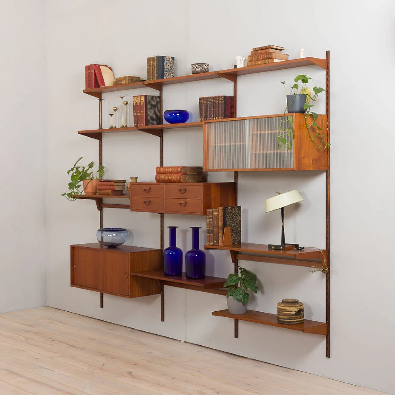Modular teak bookcase with nine wall shelves and three cabinets by K. Kristiansen for FM Mobler, 1960s 5