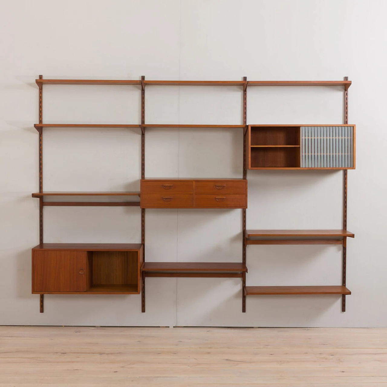 Modular teak bookcase with nine wall shelves and three cabinets by K. Kristiansen for FM Mobler, 1960s 10