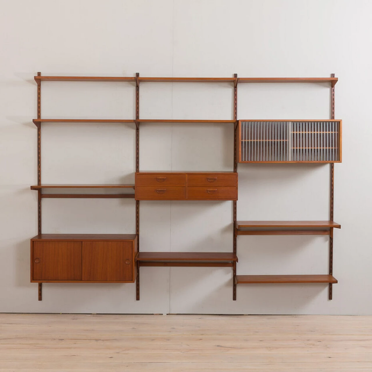 Modular teak bookcase with nine wall shelves and three cabinets by K. Kristiansen for FM Mobler, 1960s 11