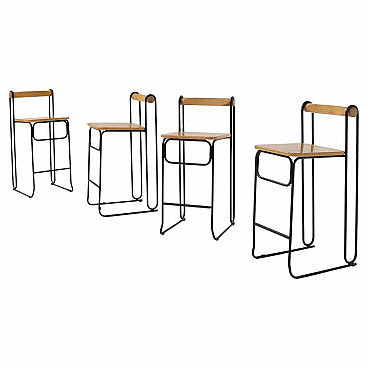 4 High geometric iron and wood stools, 1980s