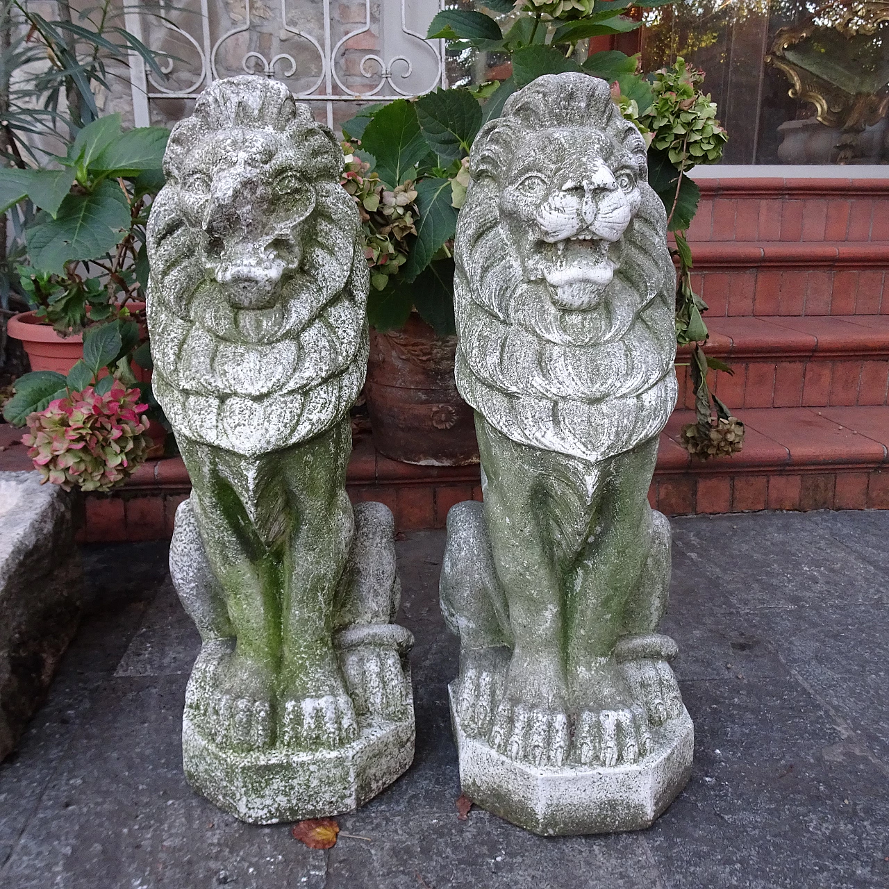 Pair of granite lion sculptures, early 20th century 1