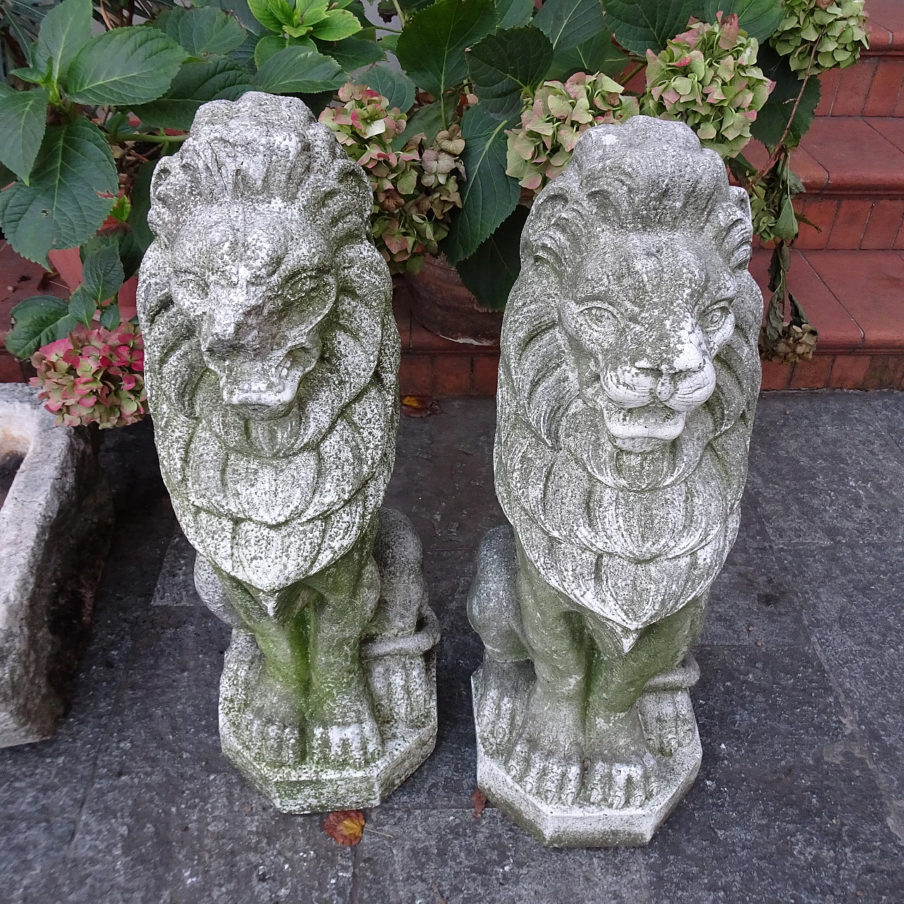 Pair of granite lion sculptures, early 20th century 4