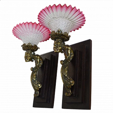 Pair of Art Deco wall lights with gargoyle and wooden bases, 1930s