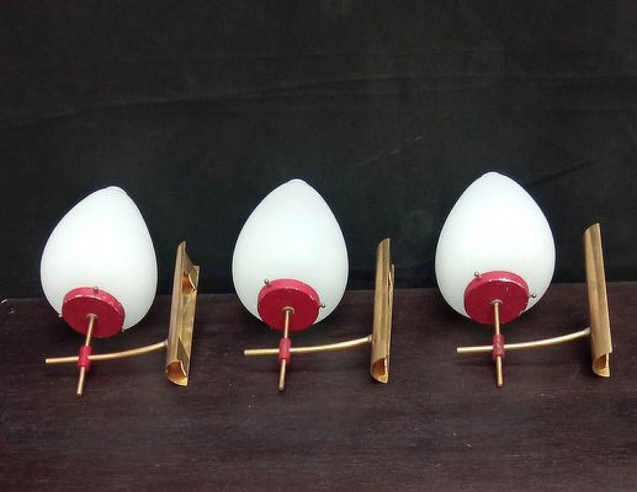 3 Glass, brass and red metal wall lights, 1950s 5