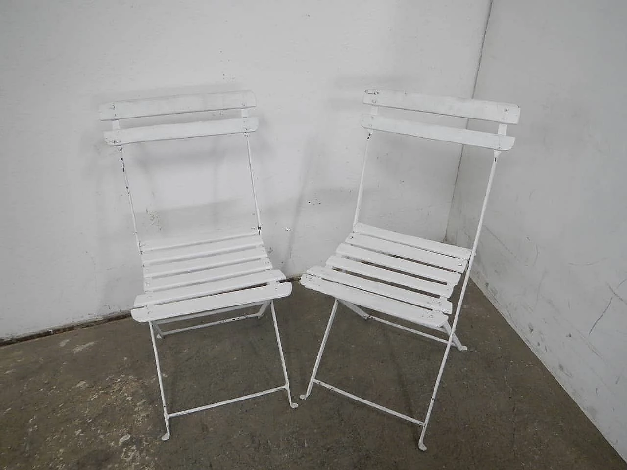 Pair of white iron and spruce folding chairs, 1950s 1