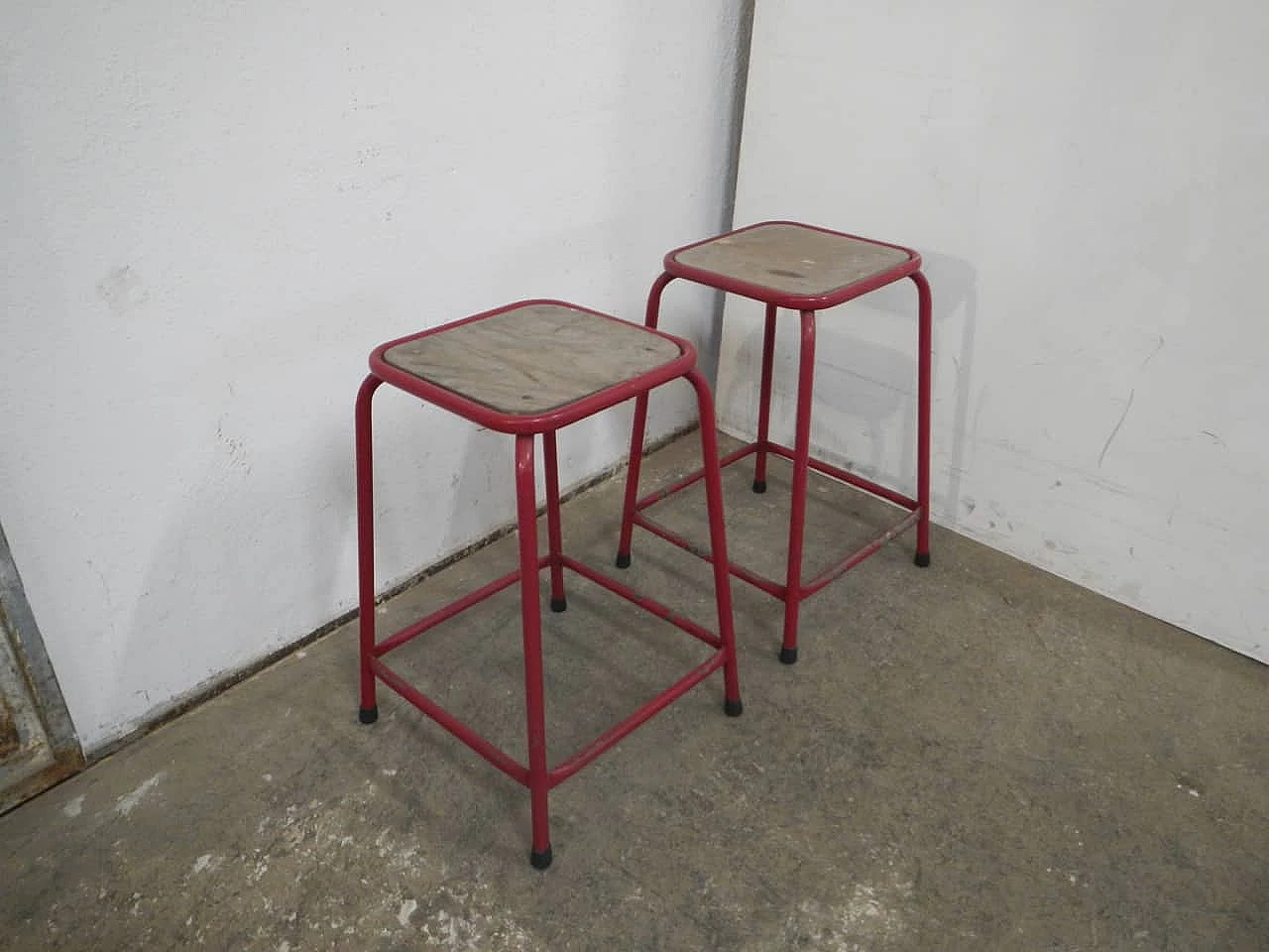 Pair of red iron and compressed wood stools, 1970s 2