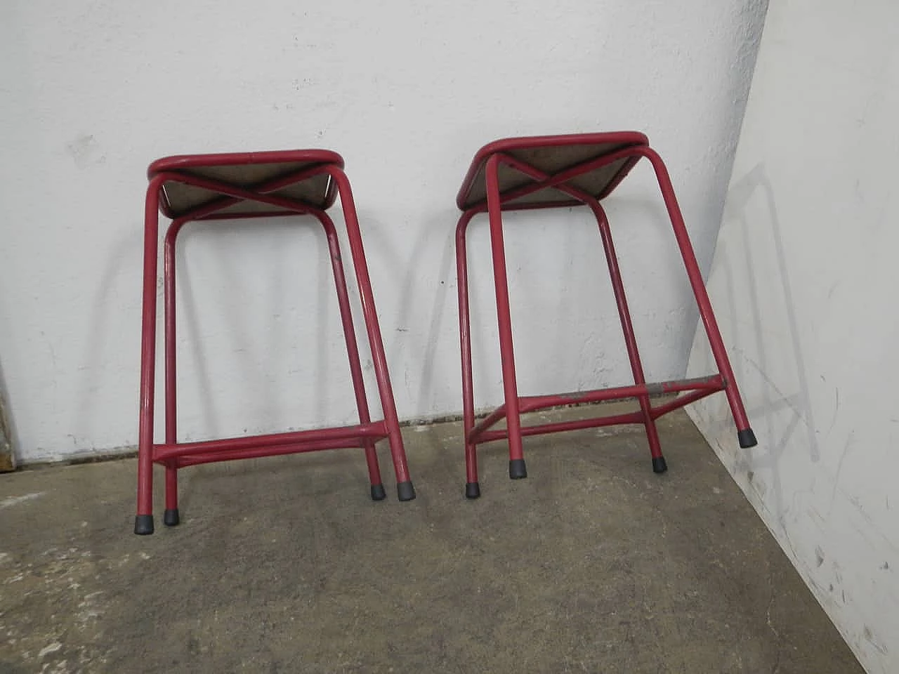 Pair of red iron and compressed wood stools, 1970s 4