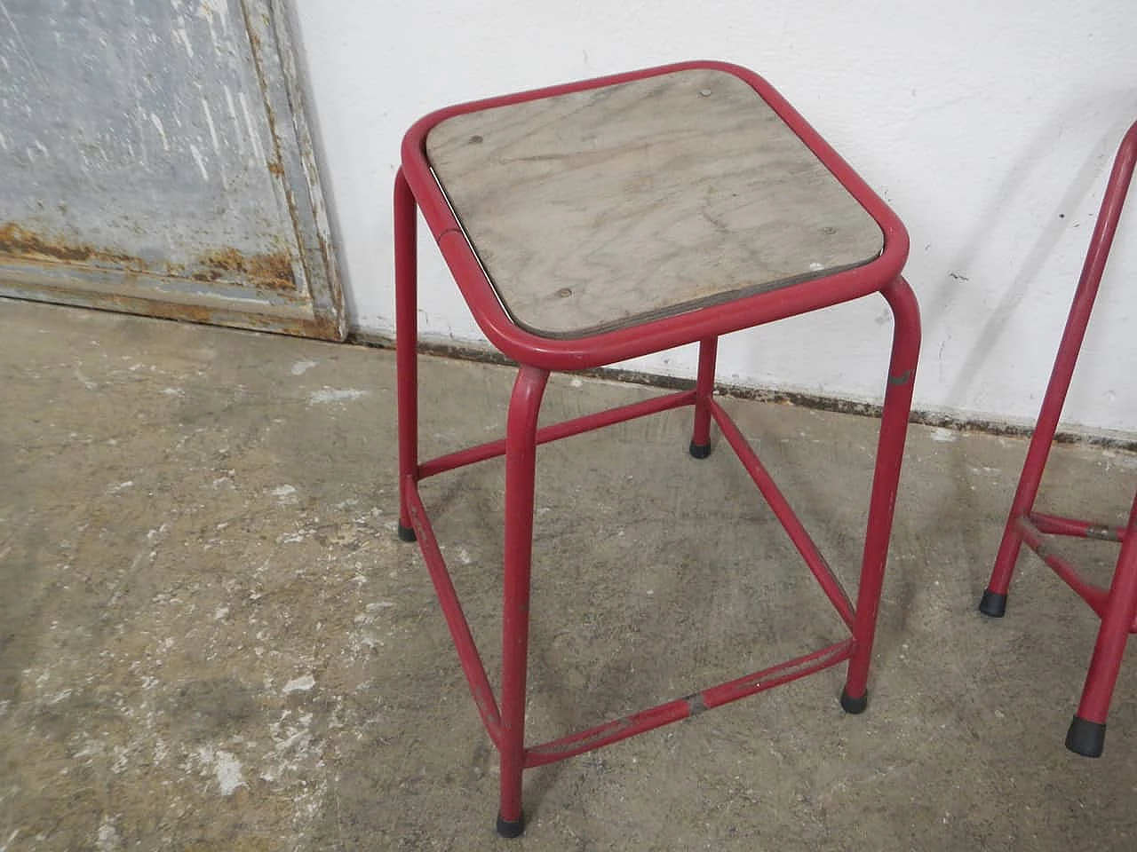 Pair of red iron and compressed wood stools, 1970s 6