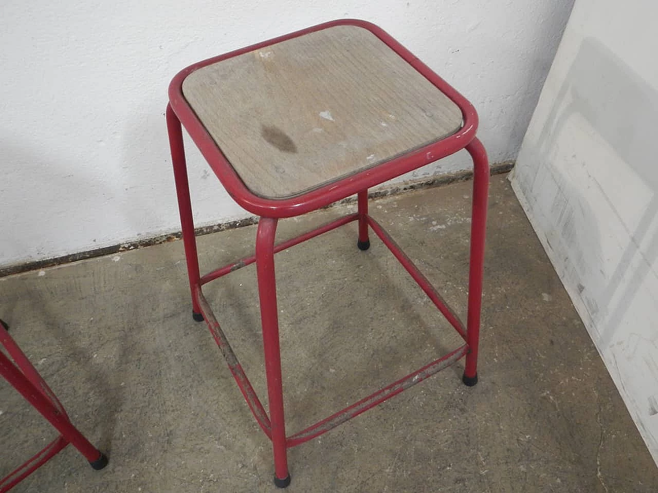 Pair of red iron and compressed wood stools, 1970s 7