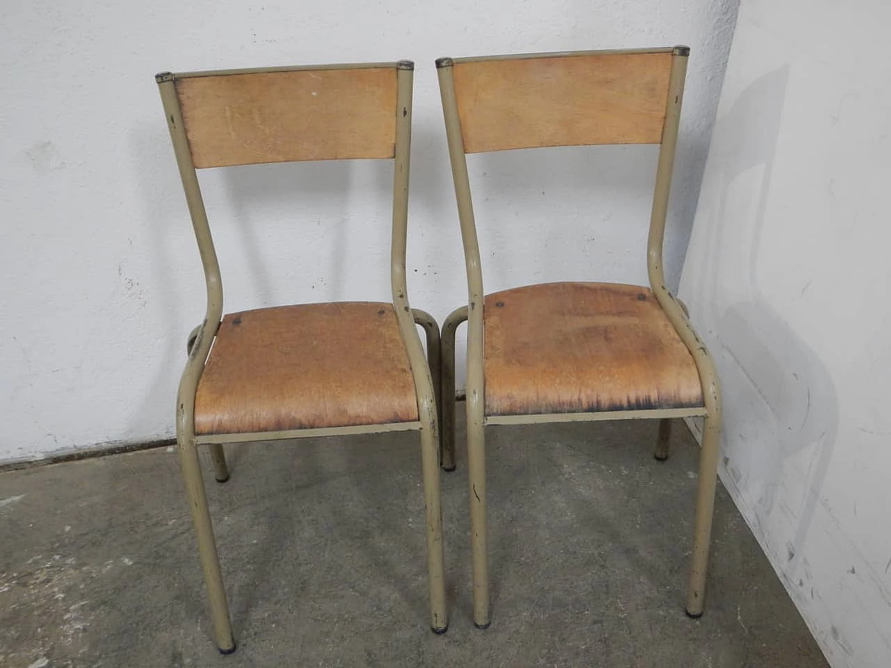 Pair of beige iron stacking chairs with birch blockboard seat by Mullca, 1960s 1